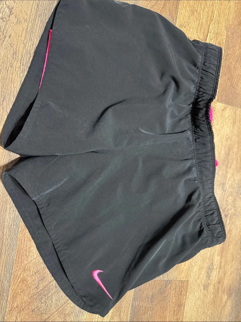 Nike Black Women's Athletic Shorts with Pink Swoosh